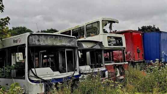 Look inside vintage motor graveyard where nostalgic 90s buses & long-forgotten Royal Mail wagon are left to rot cover image