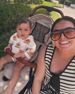 A woman and toddler in a stroller in Dubai.