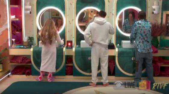 Mickey Rourke and Ella Rae Wise in a bathroom.