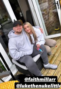 Couple sitting on patio furniture.