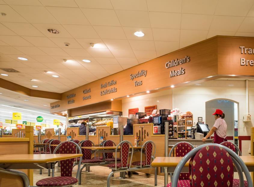 Cafe interior with tables and chairs.
