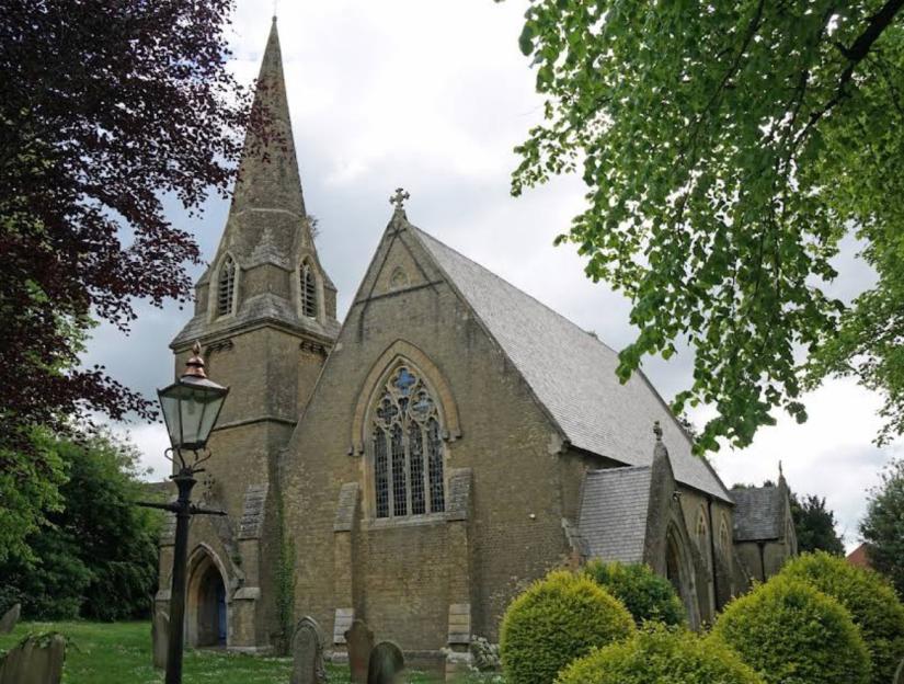 The Parish Church of Saint Mark at Friday Bridge, with its leaning spire, seen from outside.