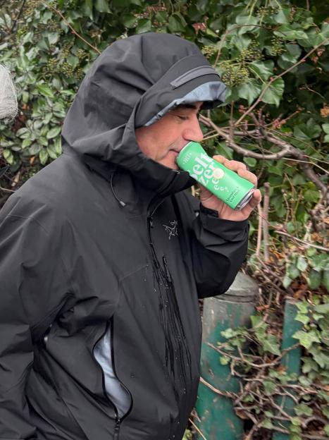 Dr Martin Kuper leaves Wimbledon Magistrates' Court, drinking from a can.