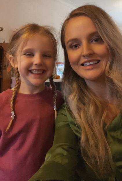 Rebecca Tidy and her daughter Mabel smiling at the camera.