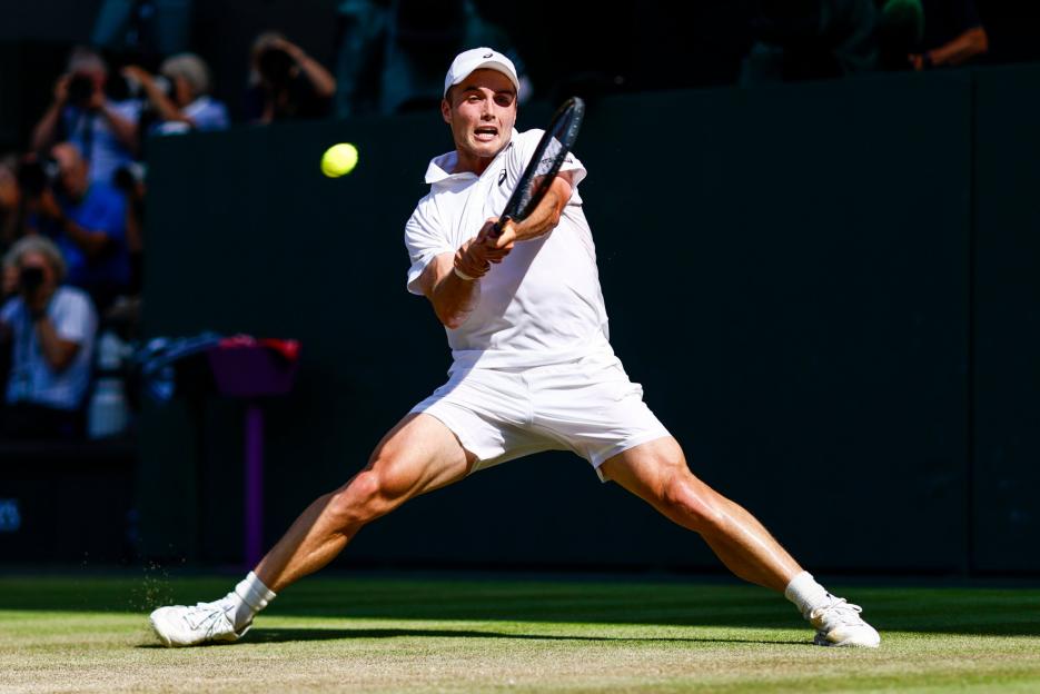 British wildcard player Arthur Fery hitting a forehand shot during his match at Wimbledon.