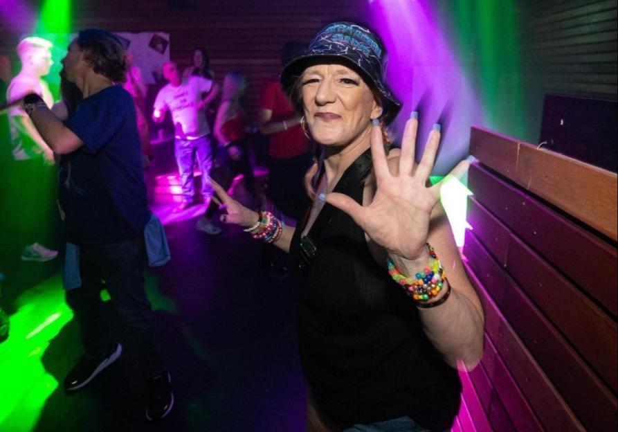 Coral Taylor dancing at a drug-fueled day rave.