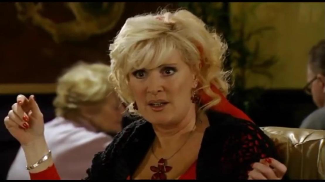 Liz McDonald reacting to an argument over dressed crab in a restaurant.