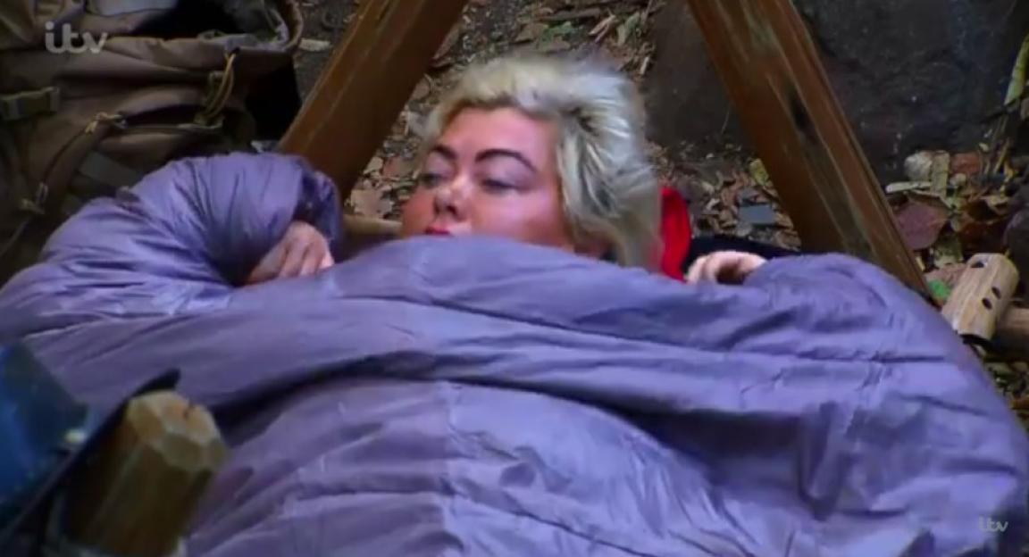 Gemma Collins in a sleeping bag looking annoyed.