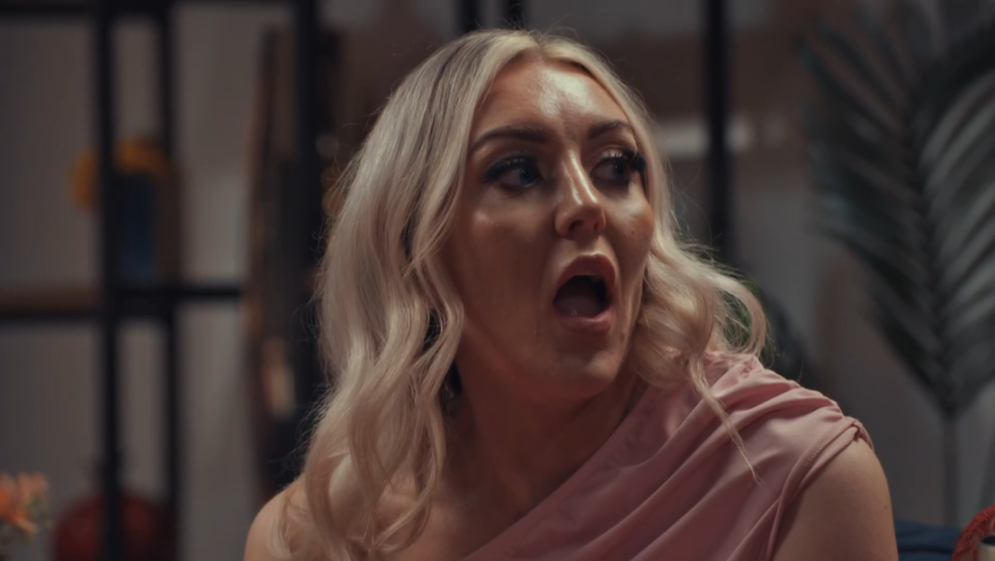 April with her mouth agape in shock.