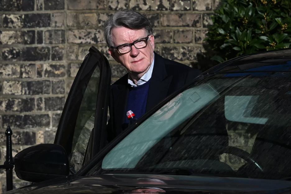 Peter Mandelson, former UK ambassador to the United States, getting into a car outside his residence.