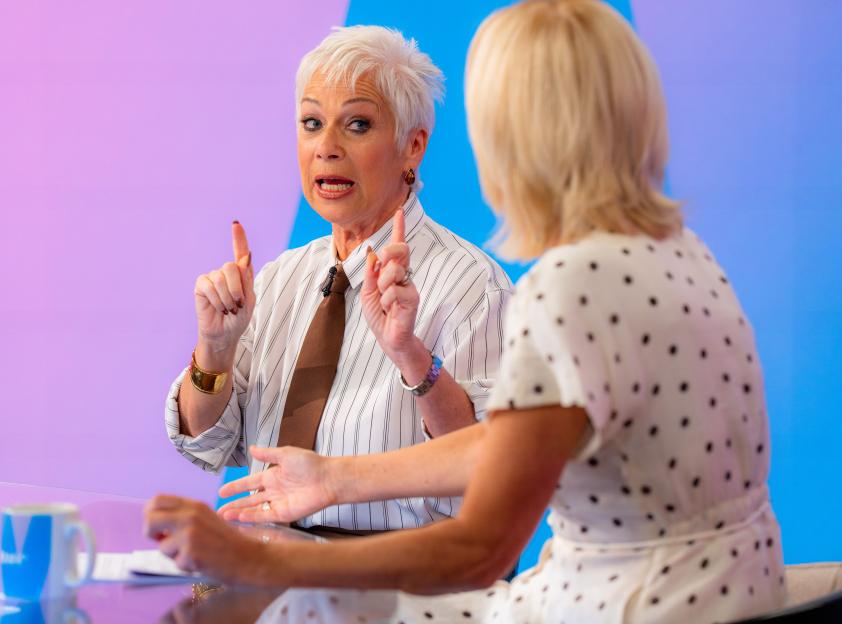 Denise Welch speaking to Jane Moore during a television programme.