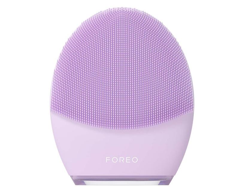 Purple FOREO facial cleansing brush.