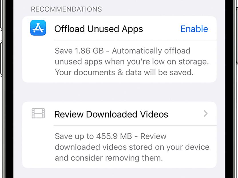 An iPhone screen showing recommendations to offload unused apps and review downloaded videos to save space.