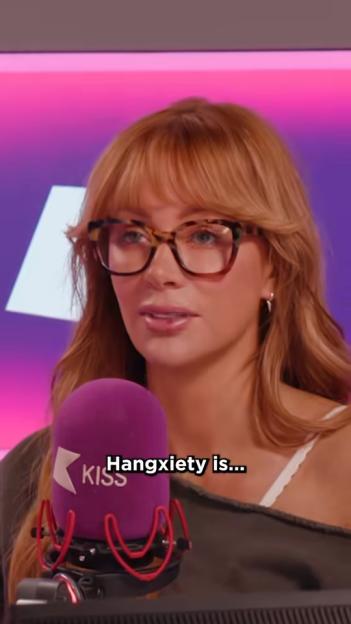 Olivia Attwood speaking into a Kiss FM microphone during a podcast.