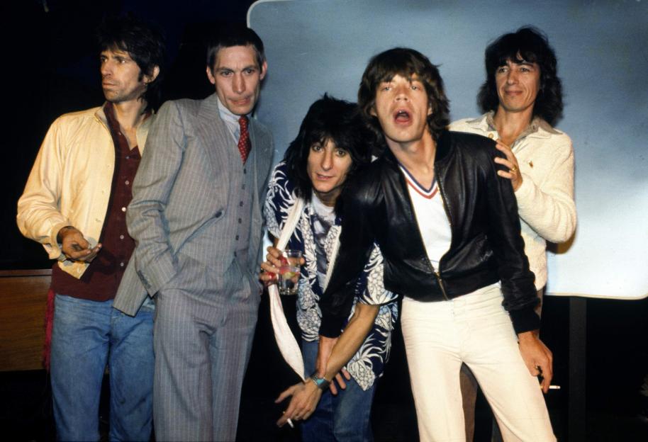 Group portrait of The Rolling Stones at a press conference.