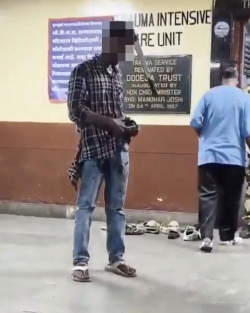 VIDEO: Man calmly waits in hospital with machete lodged in head