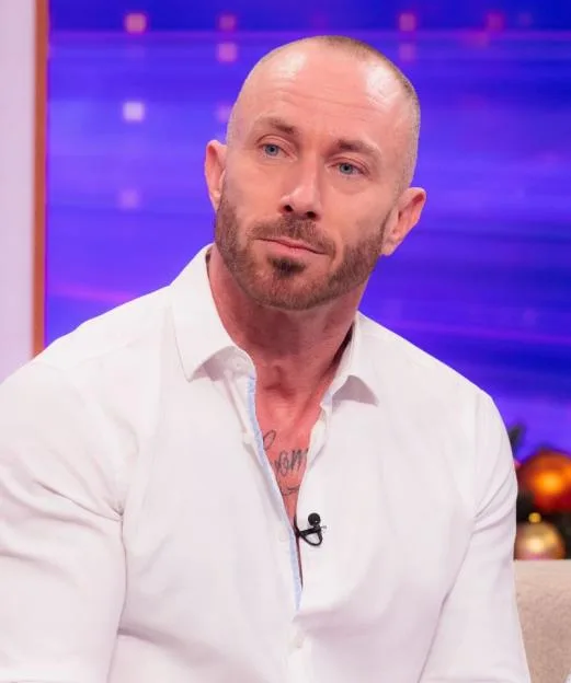James Jordan wearing a white shirt on a television programme.