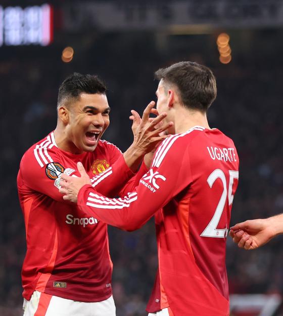 Manchester United players celebrating a goal.