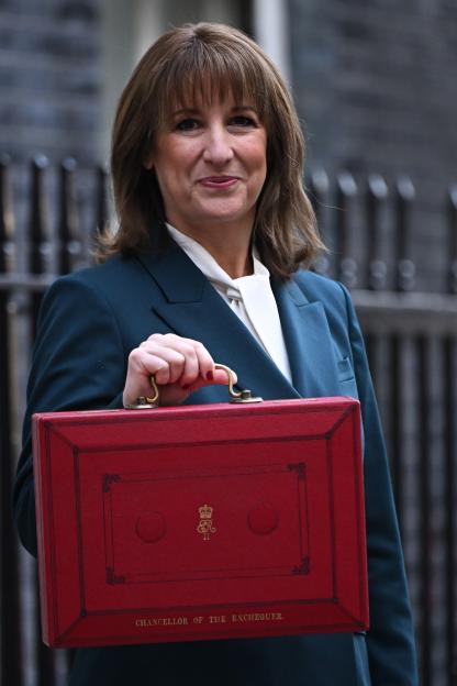 Chancellor of the Exchequer Rachel Reeves posing with the red Budget Box as she leaves 11 Downing Street.