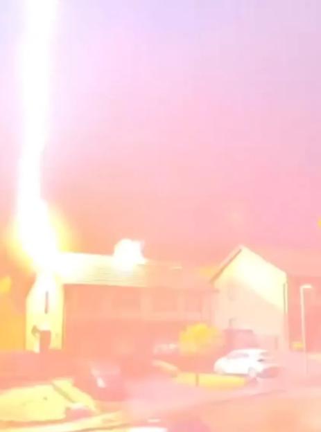 An illustration of a lightning strike hitting the roof of a house.