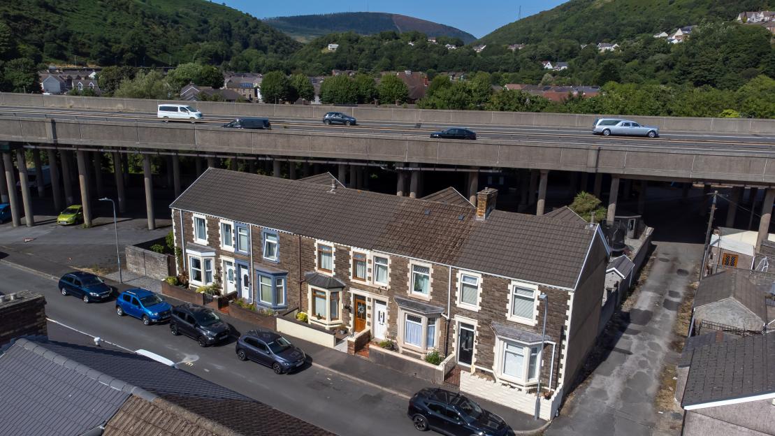 Terraced houses in the shadow of the M4 motorway in Port Talbot.