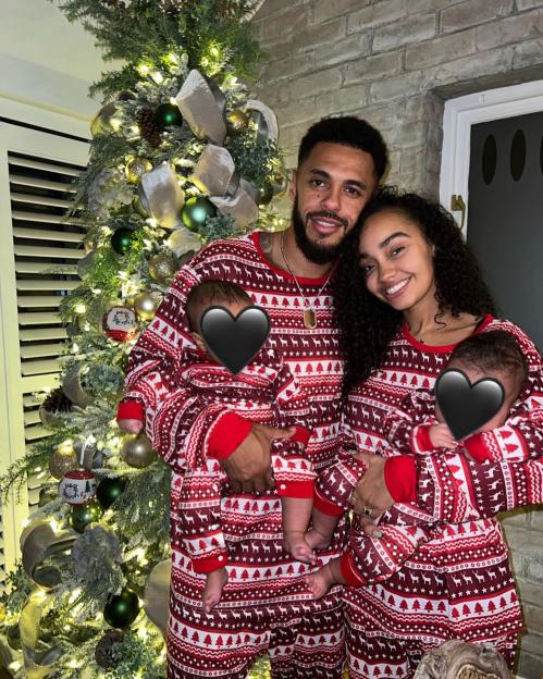 Leigh-Anne Pinnock and Andre Gray holding their twin babies in matching Christmas pajamas.