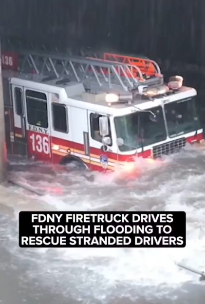 FDNY fire truck driving through severe flash flooding.