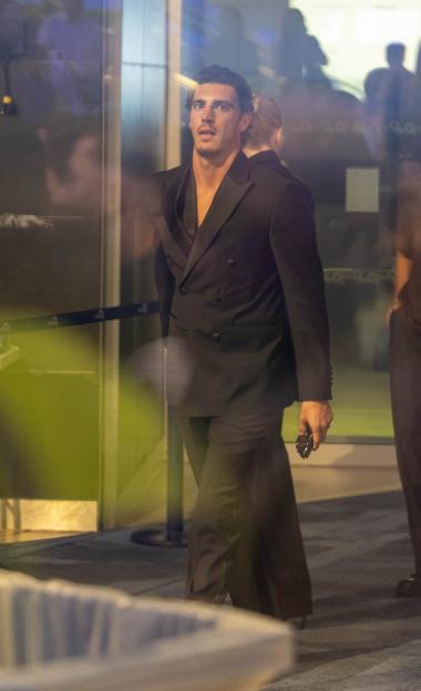Love Island's Lorenzo Alessi in a double-breasted black suit.