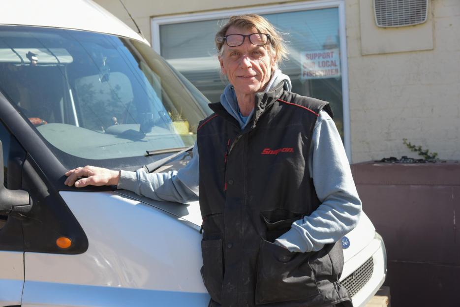 Gary Arthur of GA Restoration standing in front of a white van.