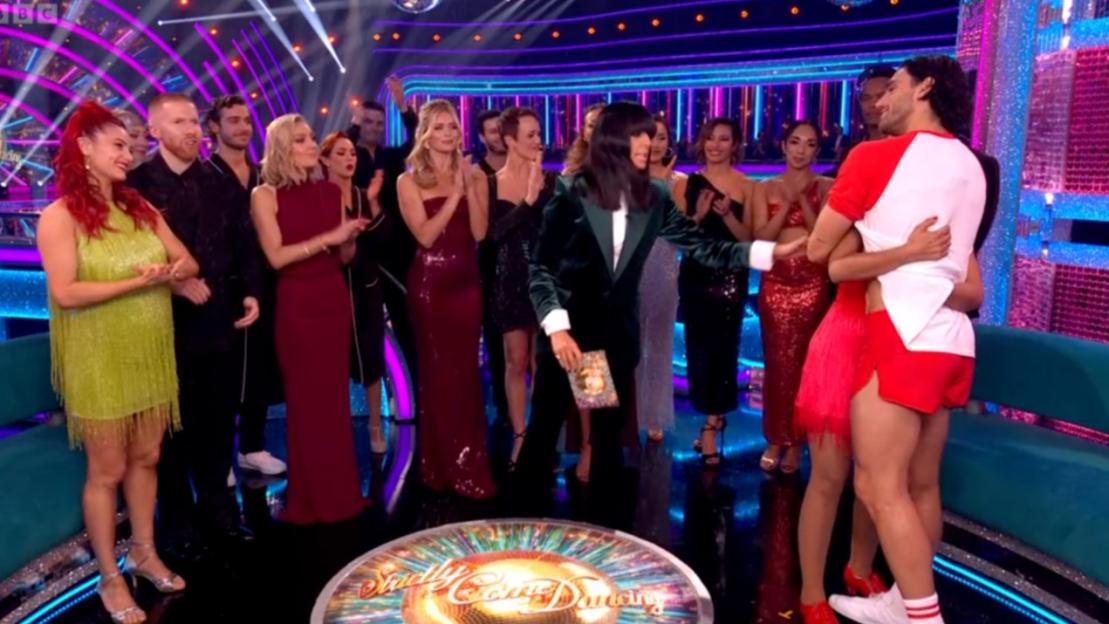 Balvinder Sopal tearfully embraces her dance partner, comforted by other contestants and the host, on the set of Strictly Come Dancing.