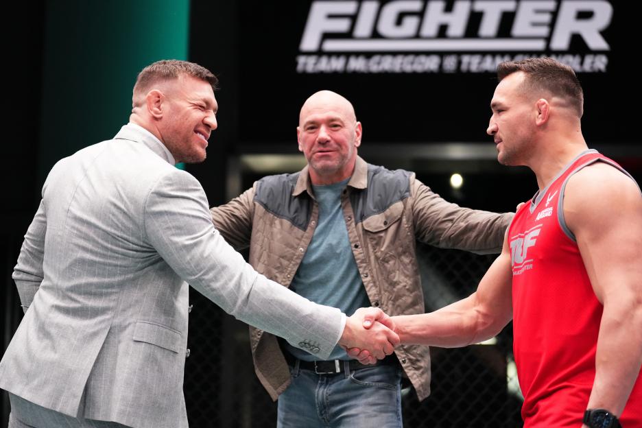 Conor McGregor and Michael Chandler shake hands during the filming of The Ultimate Fighter, with Dana White in the background.
