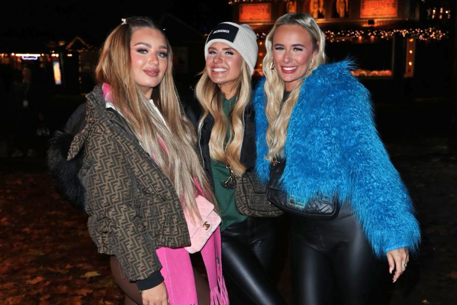 Three women pose together at the Hyde Park Winter Wonderland VIP preview night.