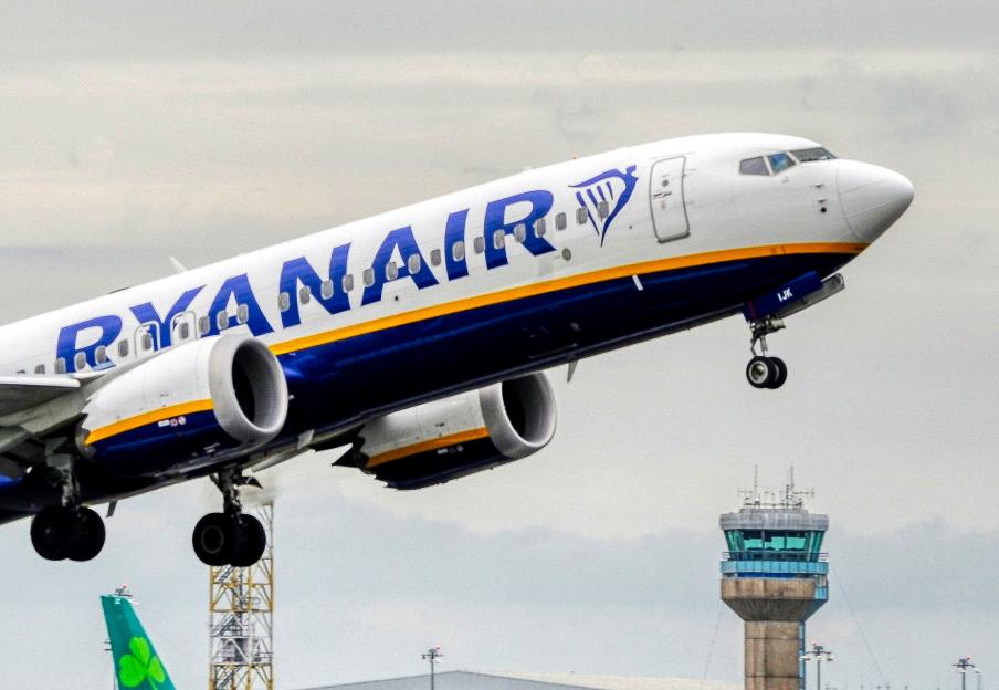 Ryanair Boeing 737 passenger jet taking off from an airport runway.