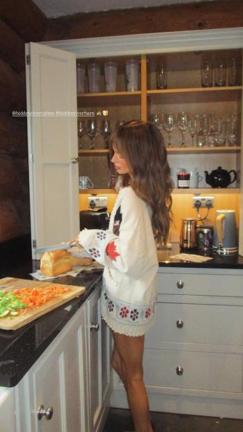 Maura Higgins in a cozy cabin
