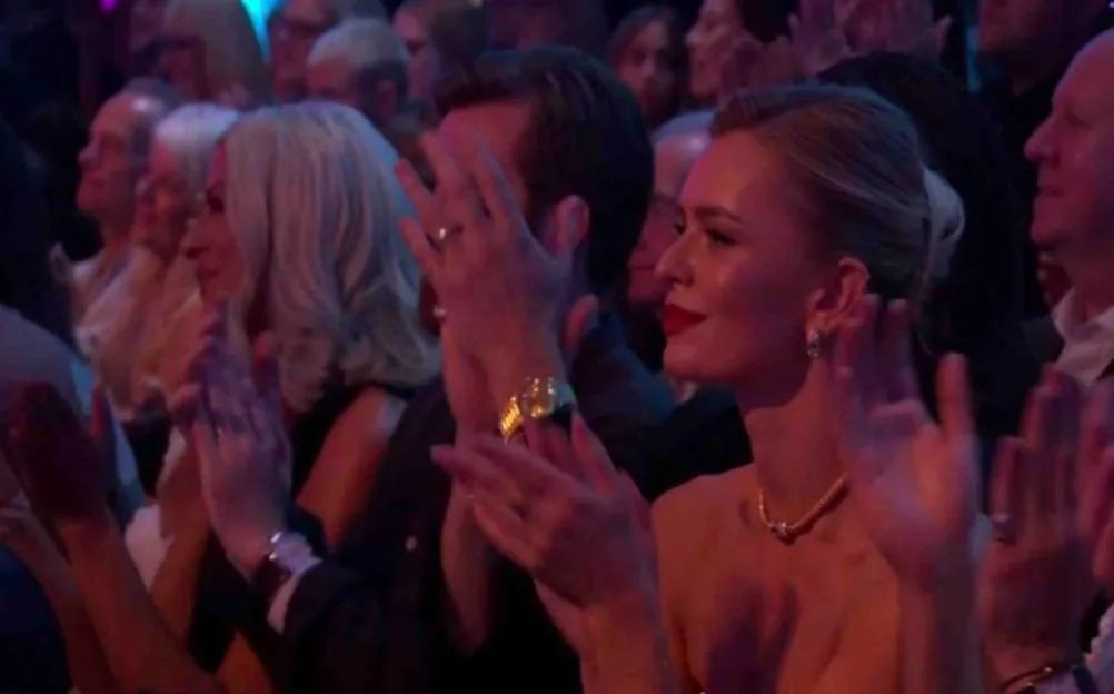 Nadiya Bychkova in the audience clapping during a live show.