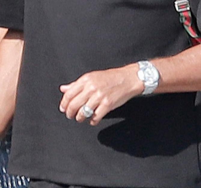 Cristiano Ronaldo's hand wearing a dazzling band on his ring finger.
