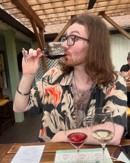 Jasper Coverdale, son of David Coverdale, drinking red wine from a wine glass.