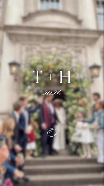 Photo of a wedding party standing on stone steps, blurred, with "T + H 2026" and a tomato icon overlaid.