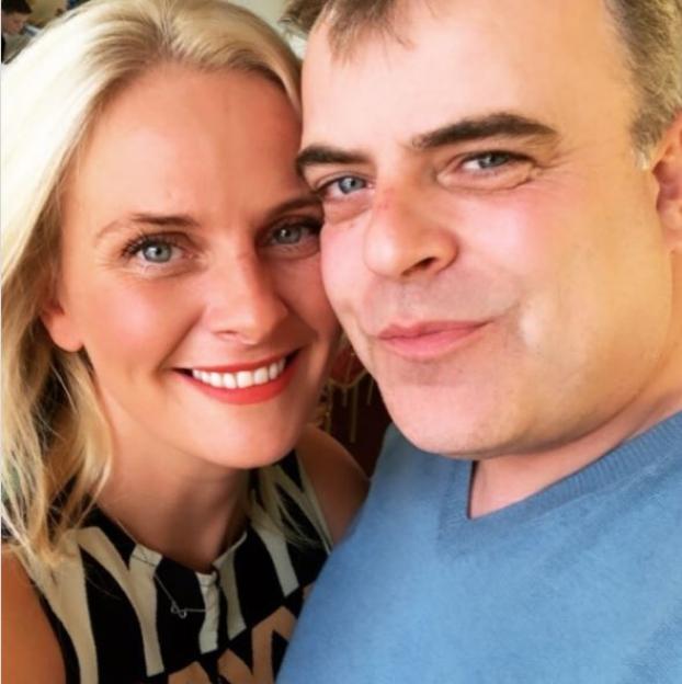 Simon Gregson and his wife Emma posing for a close-up photo.