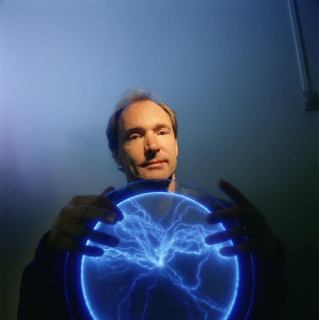 Tim Berners-Lee, inventor of the World Wide Web, holding a glowing blue plasma disk.