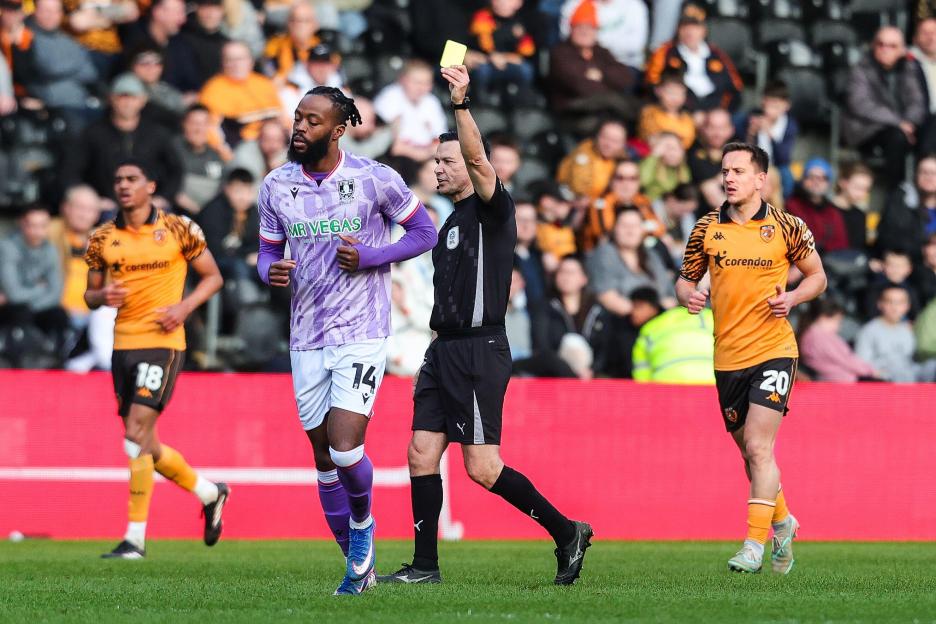 Referee Dean Whitestone gives a yellow card to Nathaniel Chalobah of Sheffield Wednesday during the Hull City v Sheffield Wednesday EFL Sky Bet Championship match at the MKM Stadium, Hull, England on 21 March 2026 Credit: Richard Bierton/Every Secon