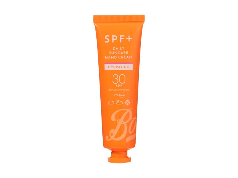 Orange tube of SPF+ Daily Suncare Hand Cream with SPF 30.