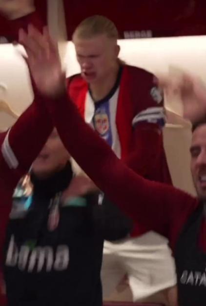Erling Haaland celebrating with teammates.