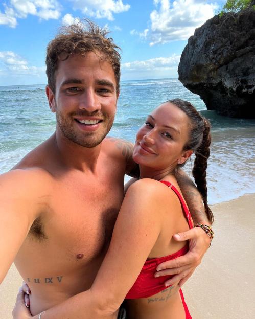 Danny Cipriani with Victoria Rose, embracing each other on a beach.