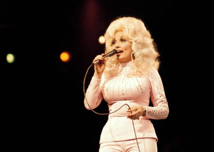 Dolly Parton performing live onstage at the UK Country Music Festival.