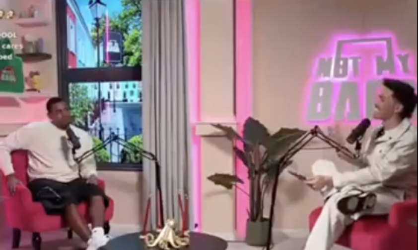 Two men seated with microphones, engaged in a podcast discussion.