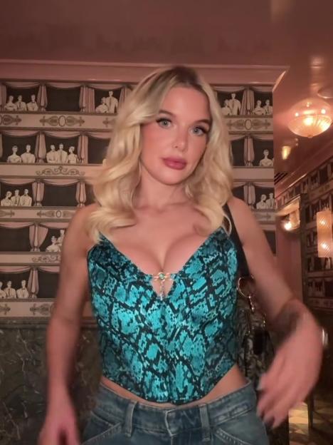 Helen Flanagan wearing a turquoise snakeskin-patterned corset top.