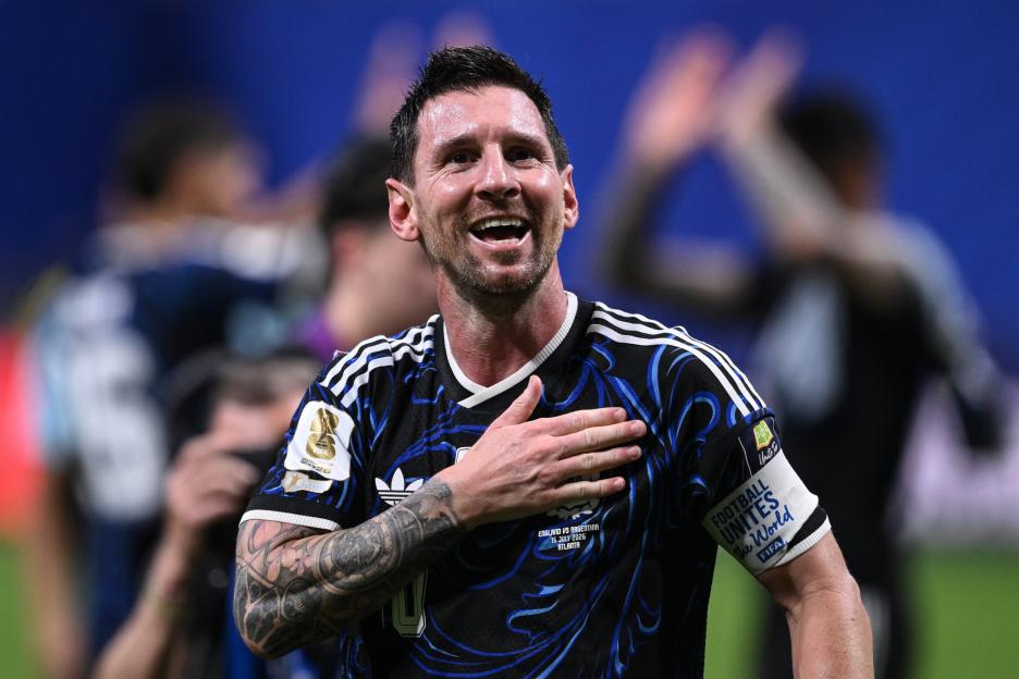 Lionel Messi celebrating with his hand on his chest.