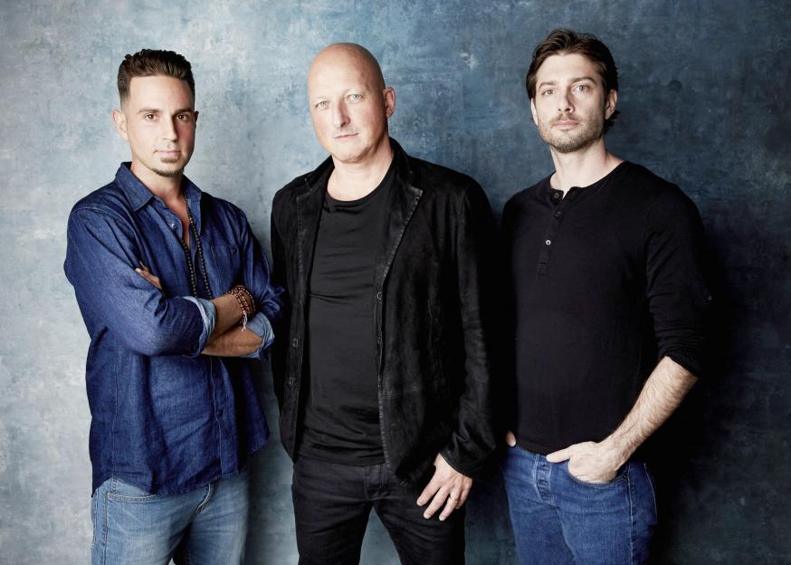 Wade Robson, director Dan Reed, and James Safechuck pose for a portrait.