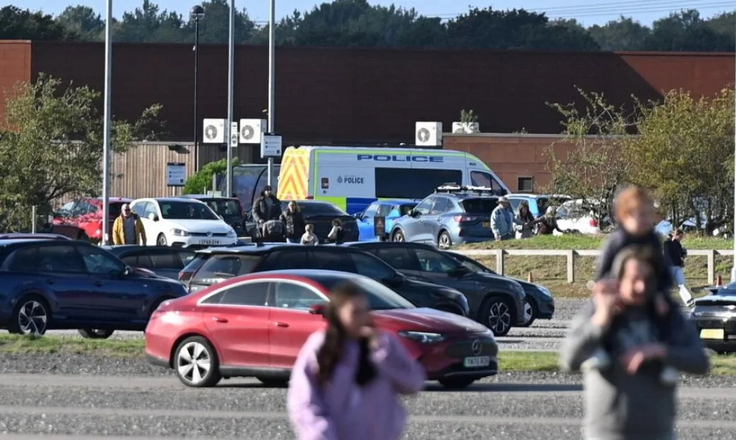 Police and emergency services present in a car park at Yorkshire Wildlife Park following an incident.